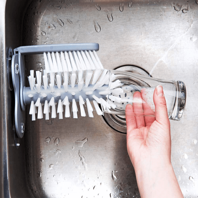 Cleaning brush with suction base bristle