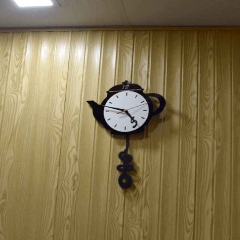 Tea kettle shaped wall clock